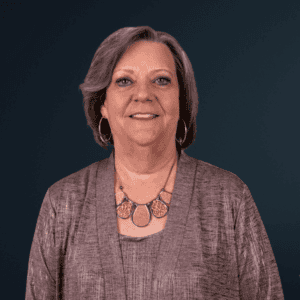 Accessible image of a woman smiling, representing community and inclusion.