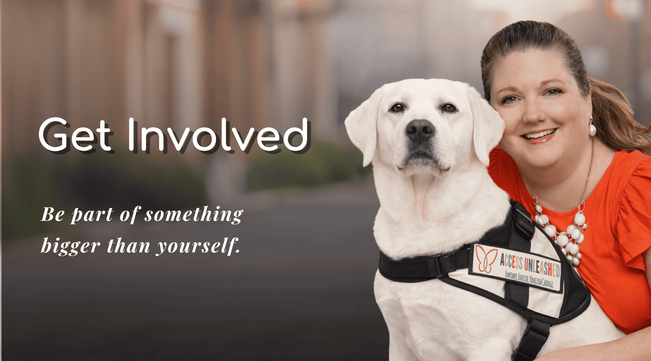 Woman with service dog promoting involvement at Access Unleashed event.