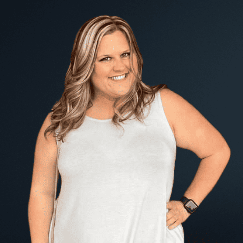 Confident woman smiling, representing empowerment and accessibility advocacy.