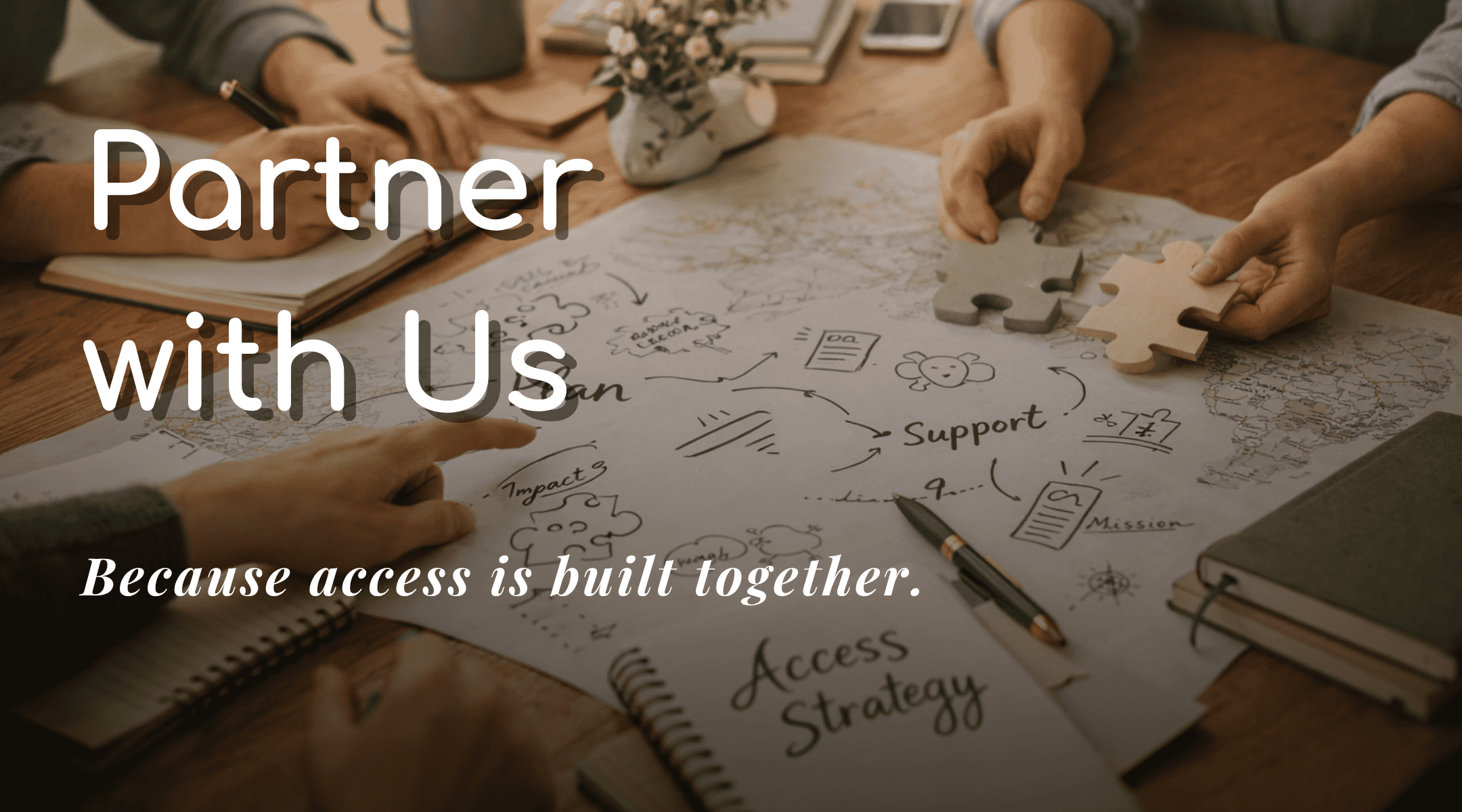 Hands assembling puzzle pieces over a strategy plan, promoting partnership and accessibility.
